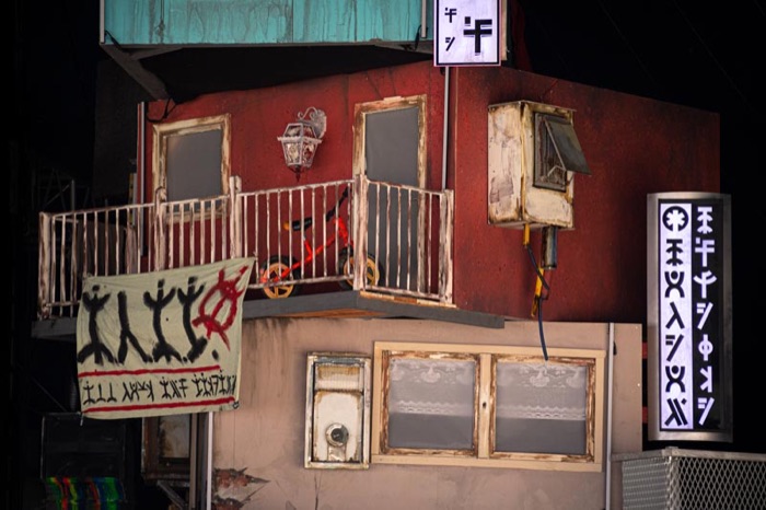 Balcony facade with painted signage and graffiti detail