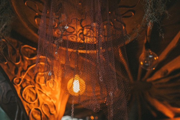 Netting and lantern detail glowing at dusk
