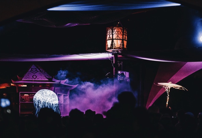 Pagoda silhouette in fog and stage lighting at night