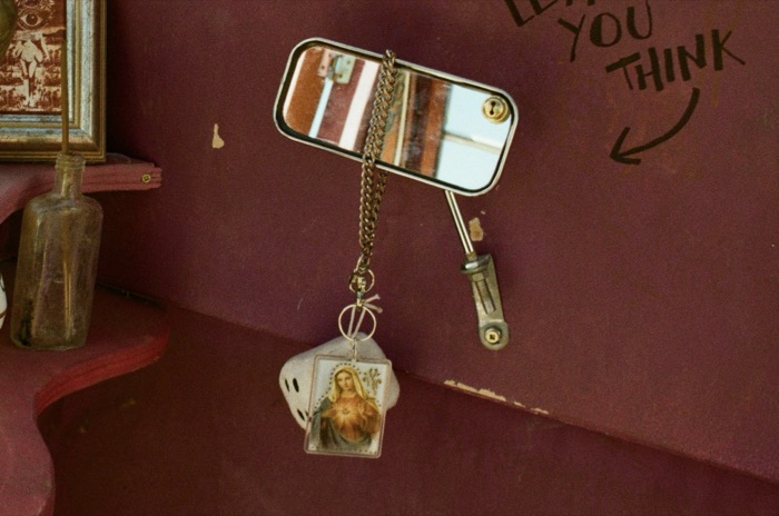 Vintage mirror and pendant decor detail