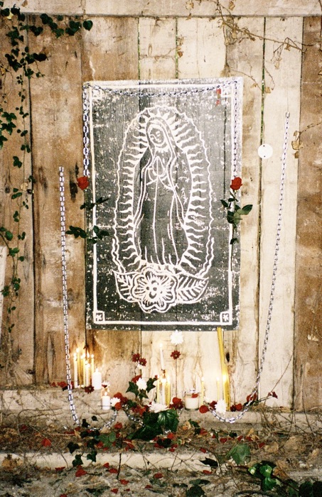 Chain and dried rose detail beside the altar